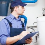 Hot-water heater service Technician servicing an hot-water heater